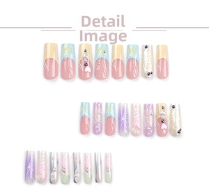 Detail of 3D macaron press-on nails with pearls, heart charms and floral reliefs