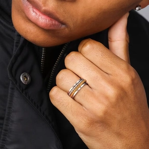 Detailed macro of S925 sterling silver men's ring with chain inlay and sparkling zircon stones
