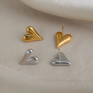Minimalist 18K gold plated heart stud earrings in polished silver and gold finishes