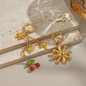 Elegant 18K gold flower and cherry pendant hoop earrings set on textured stone