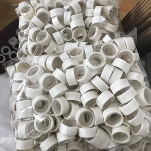 Bulk rolls of double-sided balloon glue dots showing mass packaging and quantity