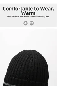 Close-up of black ribbed knit beanie featuring thick fleece lining and grey accent detail