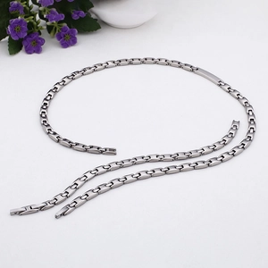 Modern silver titanium steel jewelry set featuring hollow capsule link necklace and bracelet