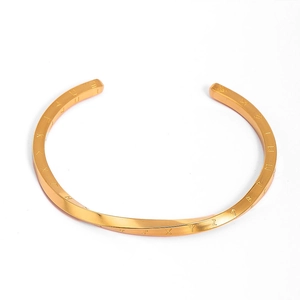 Golden Mobius Viking Rune cuff bracelet in stainless steel with twisted C-shape design