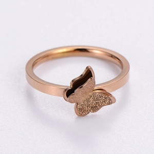 Minimalist double-layered rose gold butterfly ring with frosted wings on white background