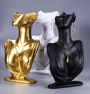 Resin portrait jewelry display stands for necklaces and earrings in gold white and black