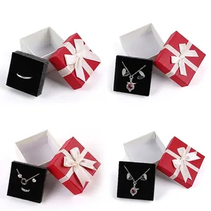 Red bowknot jewelry gift box collection in four different sizes with black foam inserts