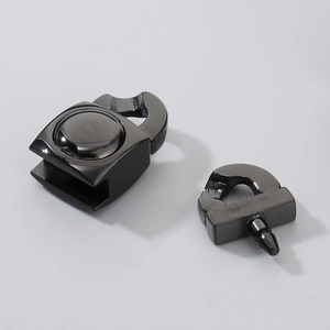 Detailed macro view of black stainless steel snap clasps showing male and female parts
