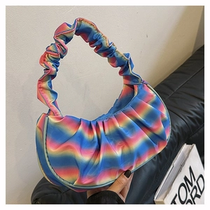 Close-up of rainbow gradient pleated fabric with soft ruffled handle on the bag