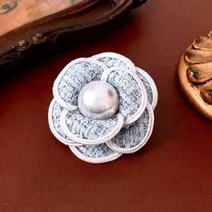 Handmade light blue tweed camellia flower brooch with pearl accent in vintage style