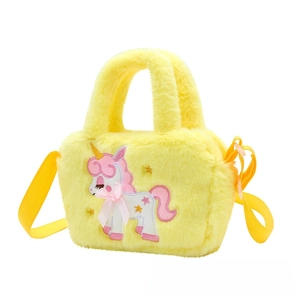Detail of yellow plush unicorn bag featuring soft faux fur and embroidered star patterns
