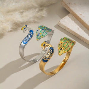 Vintage 18K gold plated peacock enamel open bangle with vibrant feather details