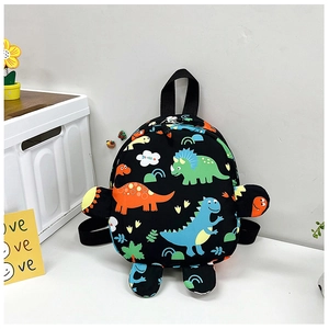 Close-up of black kids backpack featuring colorful cartoon dinosaur prints and side fins