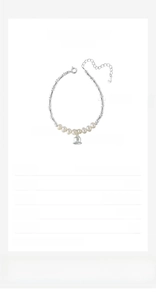Detail of S925 silver lily of the valley bracelet with freshwater pearls and bamboo links