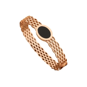 Rose gold titanium bangle featuring a hollow honeycomb mesh pattern and black oval inlay