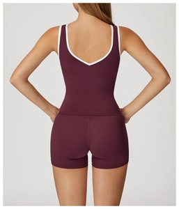Detail of cross high-waisted yoga set with contrast white piping on deep purple racerback