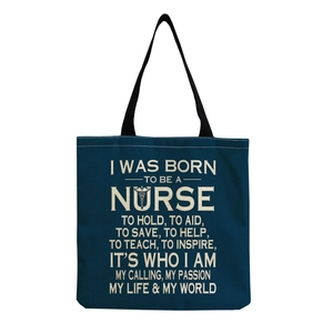 Detail of dark blue nurse canvas tote bag featuring medical caduceus and inspirational text