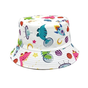 Detailed view of kids bucket hat featuring cartoon space dinosaurs and rocket patterns