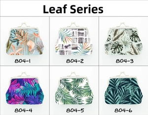 Collection of six vintage coin purses featuring tropical leaf prints and metal clasps