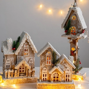 Lighted wooden Christmas house decoration with retro wood texture and snow effect