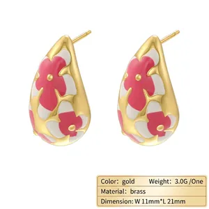 Elegant gold-plated brass teardrop earrings with pink enamel flower relief patterns