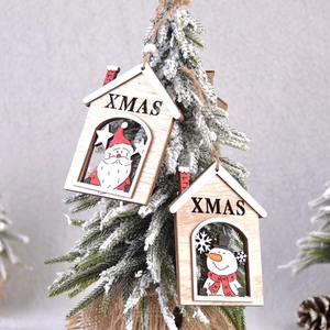 Handcrafted wooden Xmas tree ornaments featuring Santa and Snowman in a snowy setting