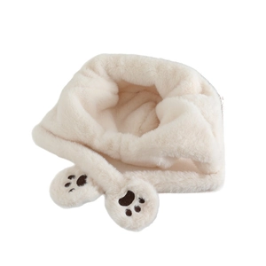Cute off-white plush puppy earflap hat for kids featuring soft faux fur and brown paw prints