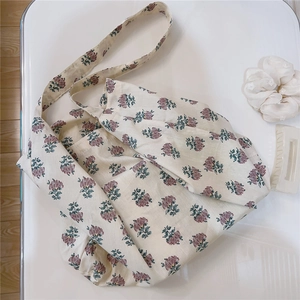Detailed top view of a vintage floral cotton tote bag with purple flower patterns