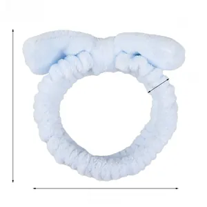Detailed view of light blue coral fleece headband with size dimensions and 37g weight info