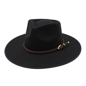 Detail of black wool fedora hat featuring a brown braided leather band and gold buckle