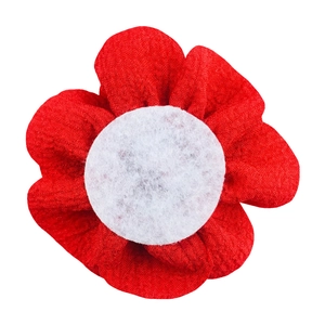Detailed view of a 7cm handmade bubble crepe red fabric flower with white felt center base