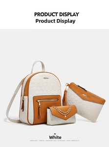 Three-piece women's backpack set featuring white and orange PU leather with ring embossing