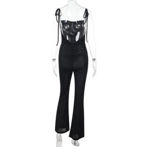 Detail of black backless jumpsuit featuring ruched design and flared leg on a mannequin