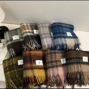 Thick plaid scarves set featuring various colors with soft wool texture and fringe trim