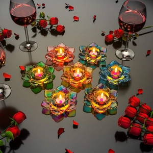 Colorful lotus glass candle holders set of seven with warm tea light flame reflection