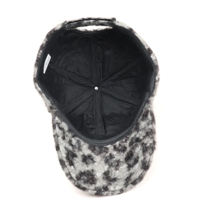 Inside view of leopard print plush baseball cap showing black lining and seam structure