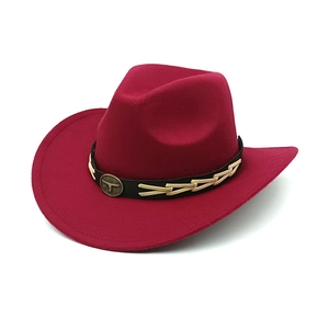 Detail of burgundy wool cowboy hat featuring vintage metal bull head and woven leather band