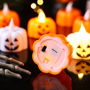 Orange and white LED pumpkin candles with warm yellow light for Halloween party decor