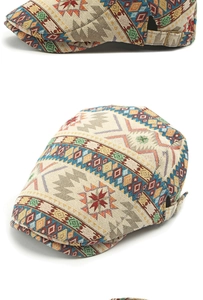 Detailed view of jacquard flat cap with colorful geometric patterns and metal buckle