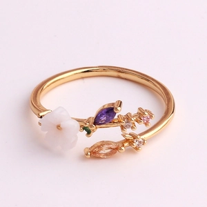 Macro detail of adjustable flower ring with colorful cubic zirconia and floral petals