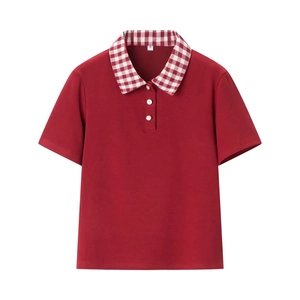 Detailed view of red short sleeve Polo shirt with red and white checkered collar fabric