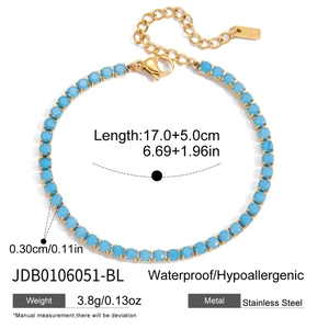 Detail of 18K gold stainless steel chain bracelet with blue zircon evil eye charm