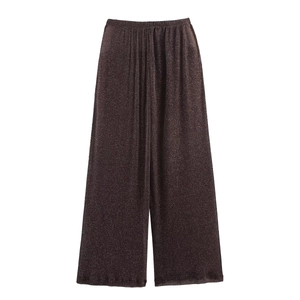 Macro shot of dark brown wide-leg pants with metallic shimmer and elastic waistband