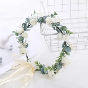 Floral wreath hair accessory with white roses and eucalyptus leaves for brides
