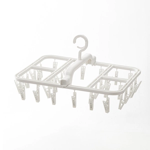 White folding multi-clip drying rack for socks and underwear on balcony