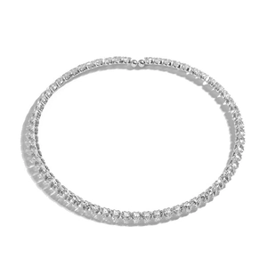 Detailed view of a silver tennis necklace with continuous sparkling diamond accents