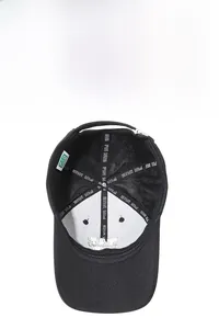 Detail view of the breathable mesh lining and reinforced inner seams of the black baseball cap
