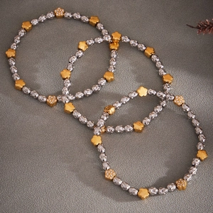 Three-piece bohemian set of stainless steel beaded bracelets with gold zircon flower charms