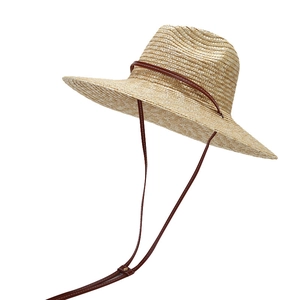 Stylish wide-brim straw beach hat with leather chin strap and decorative band for women