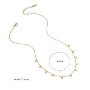 Detail of gold geometric butterfly necklace with lobster clasp and adjustable extension chain